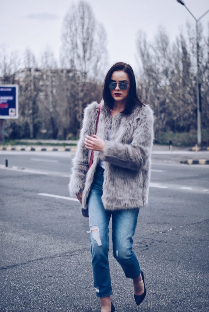 Faux fur, distressed boyfriend jeans, pumps, SoReal sunglasses by Andreea Birsan