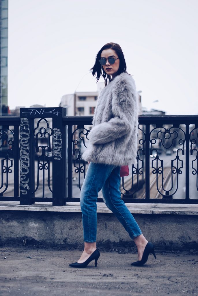 Faux fur, distressed boyfriend jeans, pumps, SoReal sunglasses by Andreea Birsan