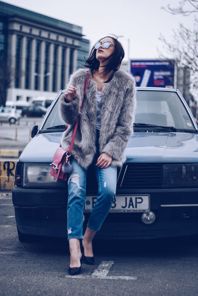 Faux fur, distressed boyfriend jeans, pumps, SoReal sunglasses by Andreea Birsan