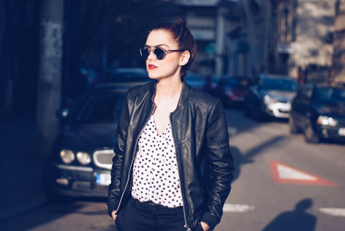 Leather jacket, polka dot shirt, black trousers, white sneakers, so real sunglasses by Andreea Birsan