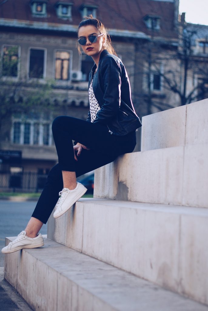 Leather jacket, polka dot shirt, black trousers, white sneakers, so real sunglasses by Andreea Birsan