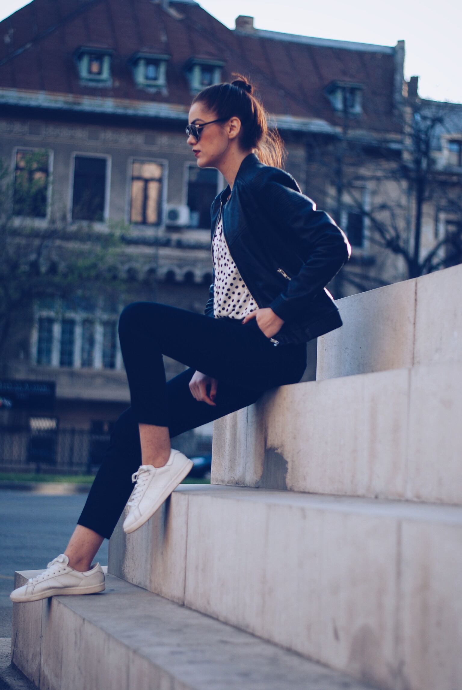 Leather jacket, polka dot shirt, black trousers, white sneakers, so real sunglasses by Andreea Birsan