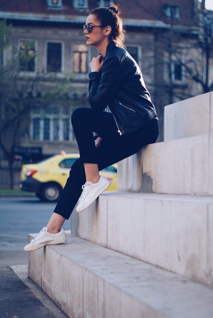 Leather jacket, polka dot shirt, black trousers, white sneakers, so real sunglasses by Andreea Birsan