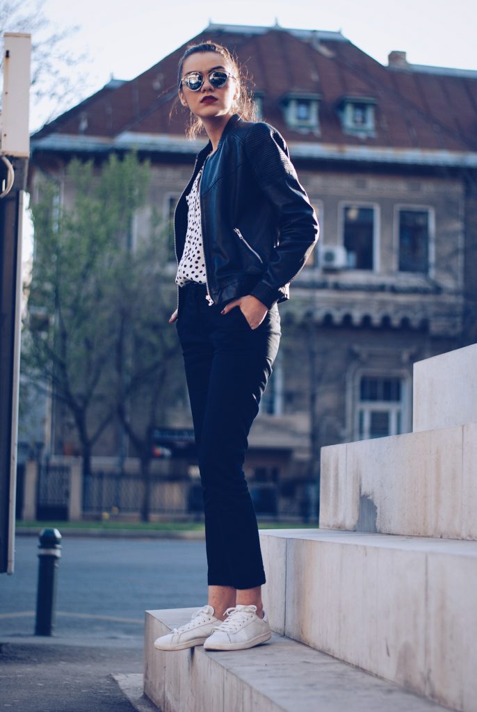 Leather jacket, polka dot shirt, black trousers, white sneakers, so real sunglasses by Andreea Birsan