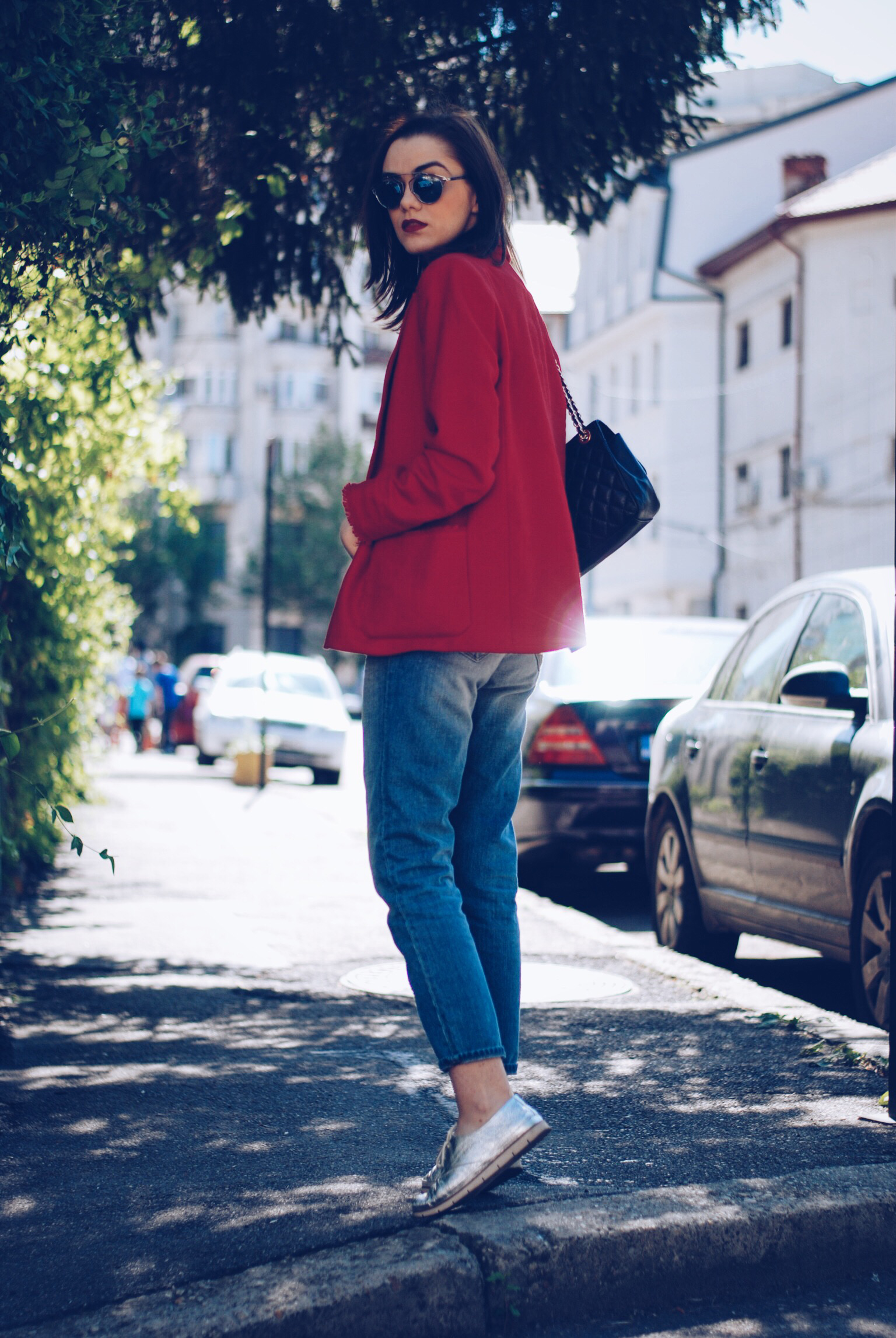 Red blazer, striped shirt, distressed boyfriend jeans, silver shoes, black leather bag, so real sunglasses by Andreea Birsan