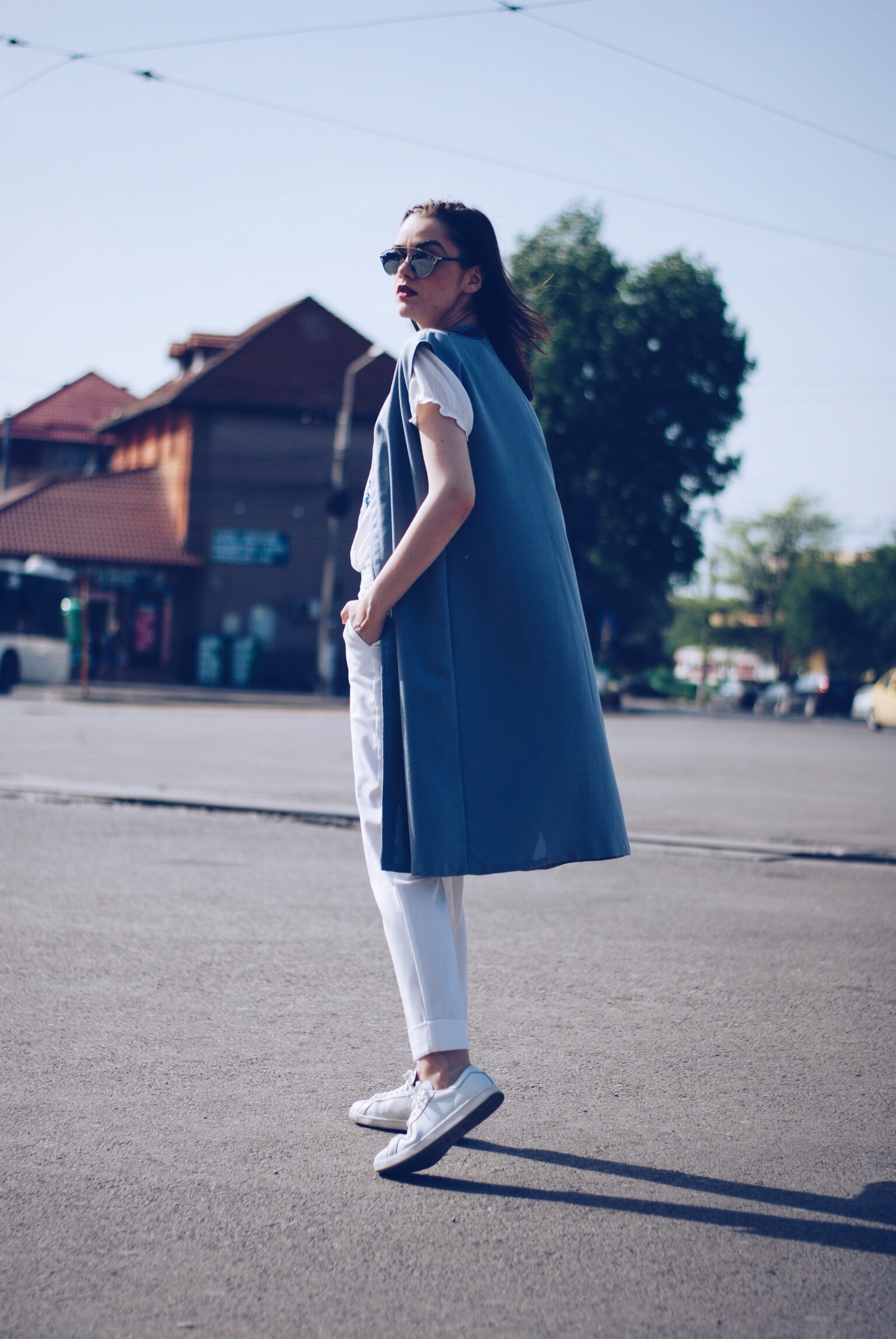 White outfit, white embroidered shirt, white trousers, white sneakers, so real sunglasses, grey vest by Andreea Birsan