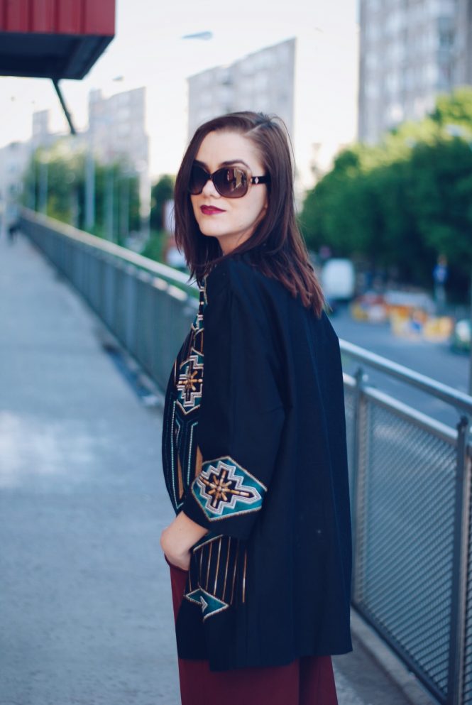 Burgundy culottes, white tshirt, embellished jacket, polaroid sunglasses, gold metallic shoes, red backpack, spring outfit by Andreea Birsan