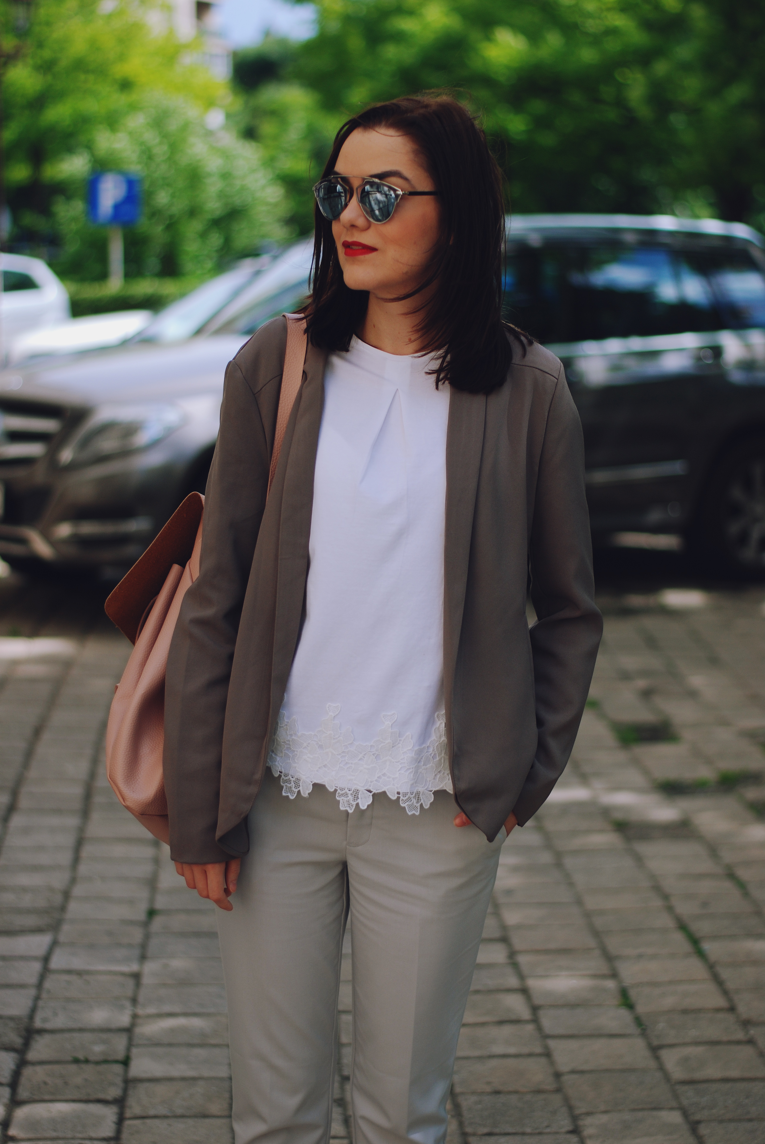 Grey trousers, white tshirt, lace detail, blazer, blush pink backpack, silver metallic shoes, so real sunglasses, spring outfit by Andreea Birsan