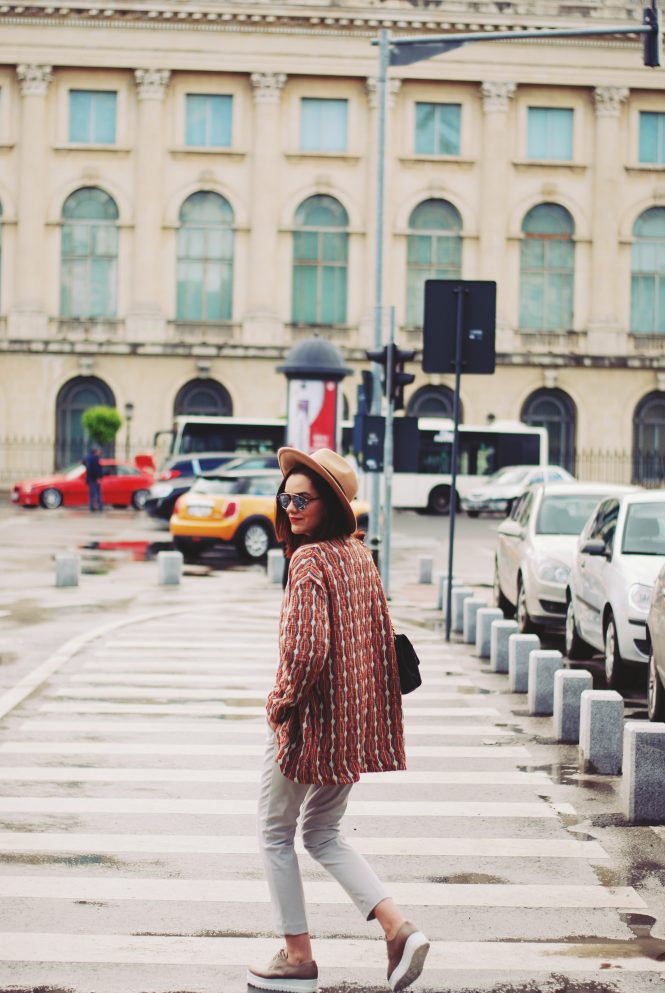 Patterned jacket, camel hat, so real sunglasses, grey trousers, graphic tshirt, nude shoes, black bag, spring outfit by Andreea Birsan