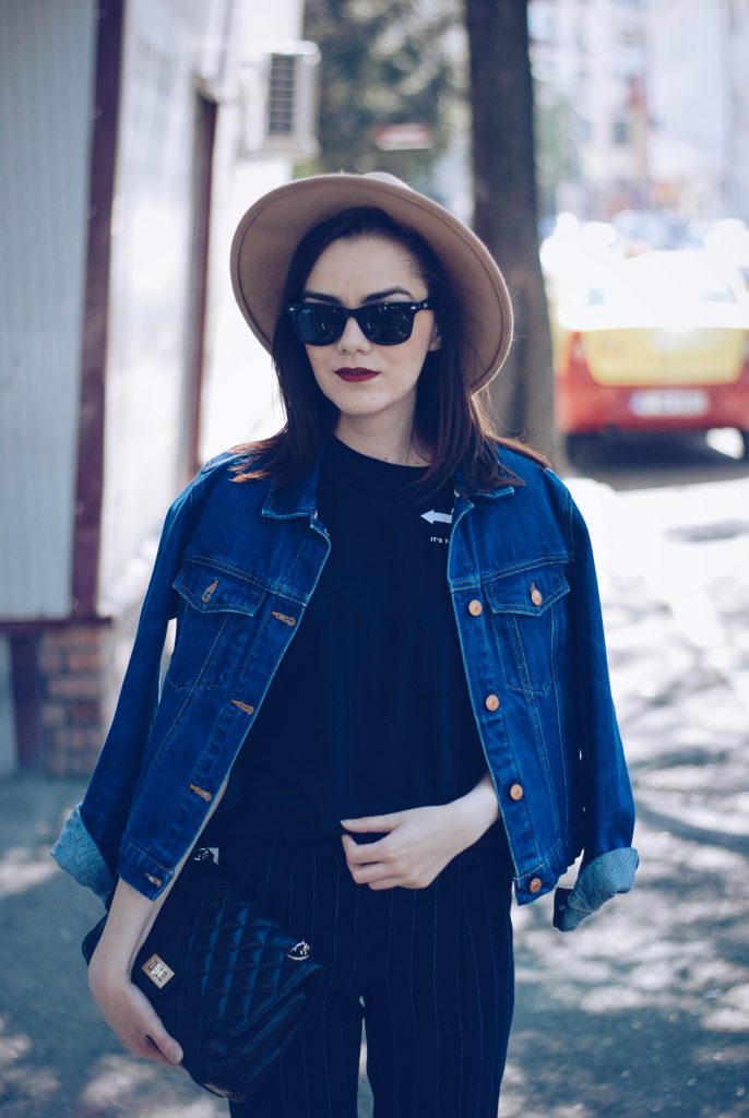 Pinstripe pants, camel hat, black tshirt, denim jacket, sunglasses, beige lace up flats, spring outfit by Andreea Birsan