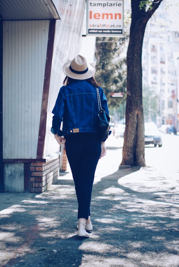 Pinstripe pants, camel hat, black tshirt, denim jacket, sunglasses, beige lace up flats, spring outfit by Andreea Birsan