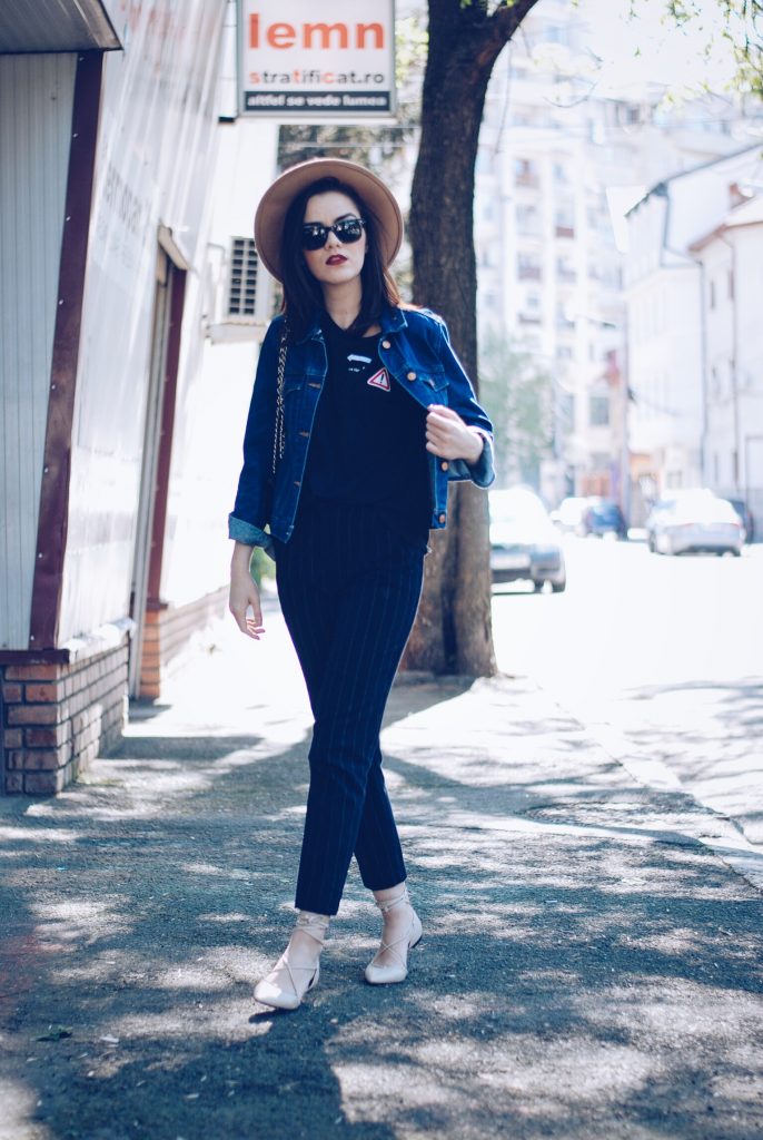 Pinstripe pants, camel hat, black tshirt, denim jacket, sunglasses, beige lace up flats, spring outfit by Andreea Birsan