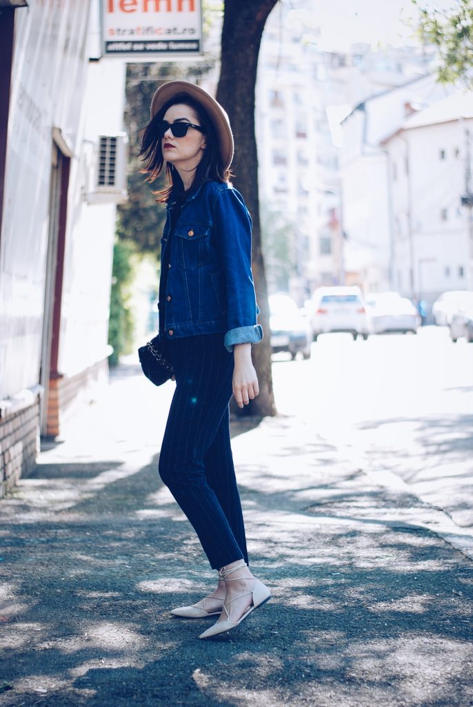 Pinstripe pants, camel hat, black tshirt, denim jacket, sunglasses, beige lace up flats, spring outfit by Andreea Birsan