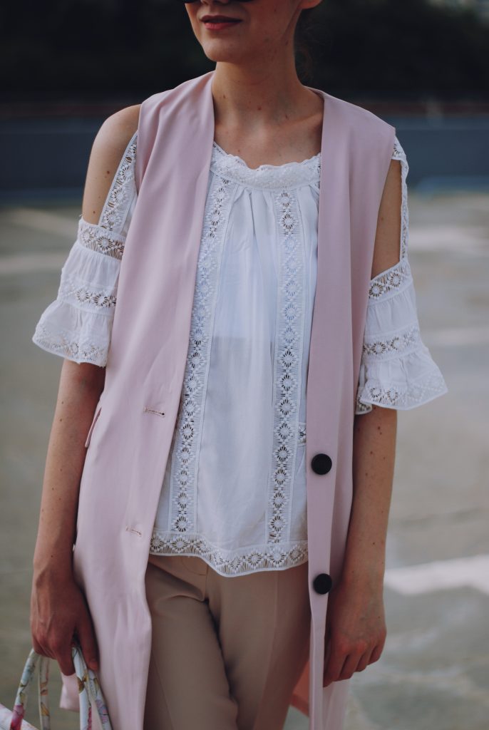 Pink trousers, lace cutout white blouse, black sunglasses, pink waistcoat vest, gold metallic oxford shoes, flower print bag, cute pink summer outfit, Andreea Birsan