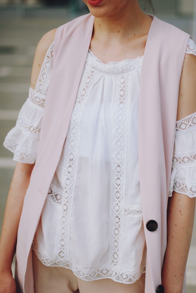 Pink trousers, lace cutout white blouse, black sunglasses, pink waistcoat vest, gold metallic oxford shoes, flower print bag, cute pink summer outfit, Andreea Birsan