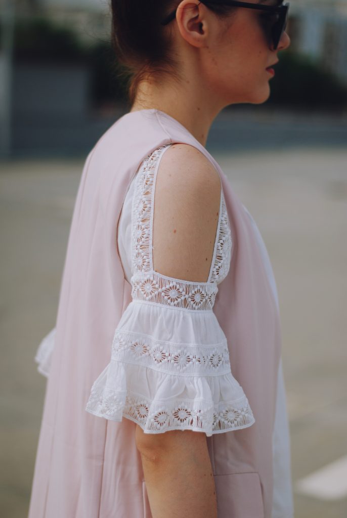 Pink trousers, lace cutout white blouse, black sunglasses, pink waistcoat vest, gold metallic oxford shoes, flower print bag, cute pink summer outfit, Andreea Birsan