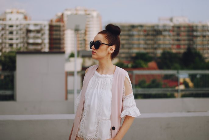 Pink trousers, lace cutout white blouse, black sunglasses, pink waistcoat vest, gold metallic oxford shoes, flower print bag, cute pink summer outfit, Andreea Birsan