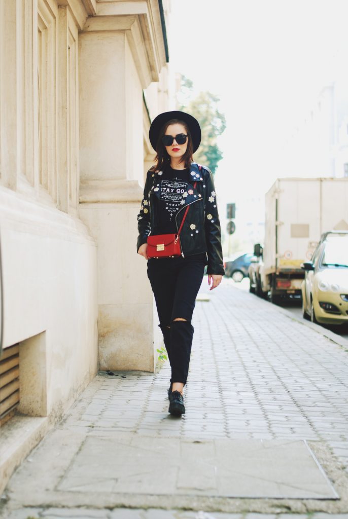 Black mom jeans, printed tshirt, embroidered leather jacket, fedora hat, sunglasses, red crossbody bag, glitter shoes, fall outfit idea, Andreea Birsan