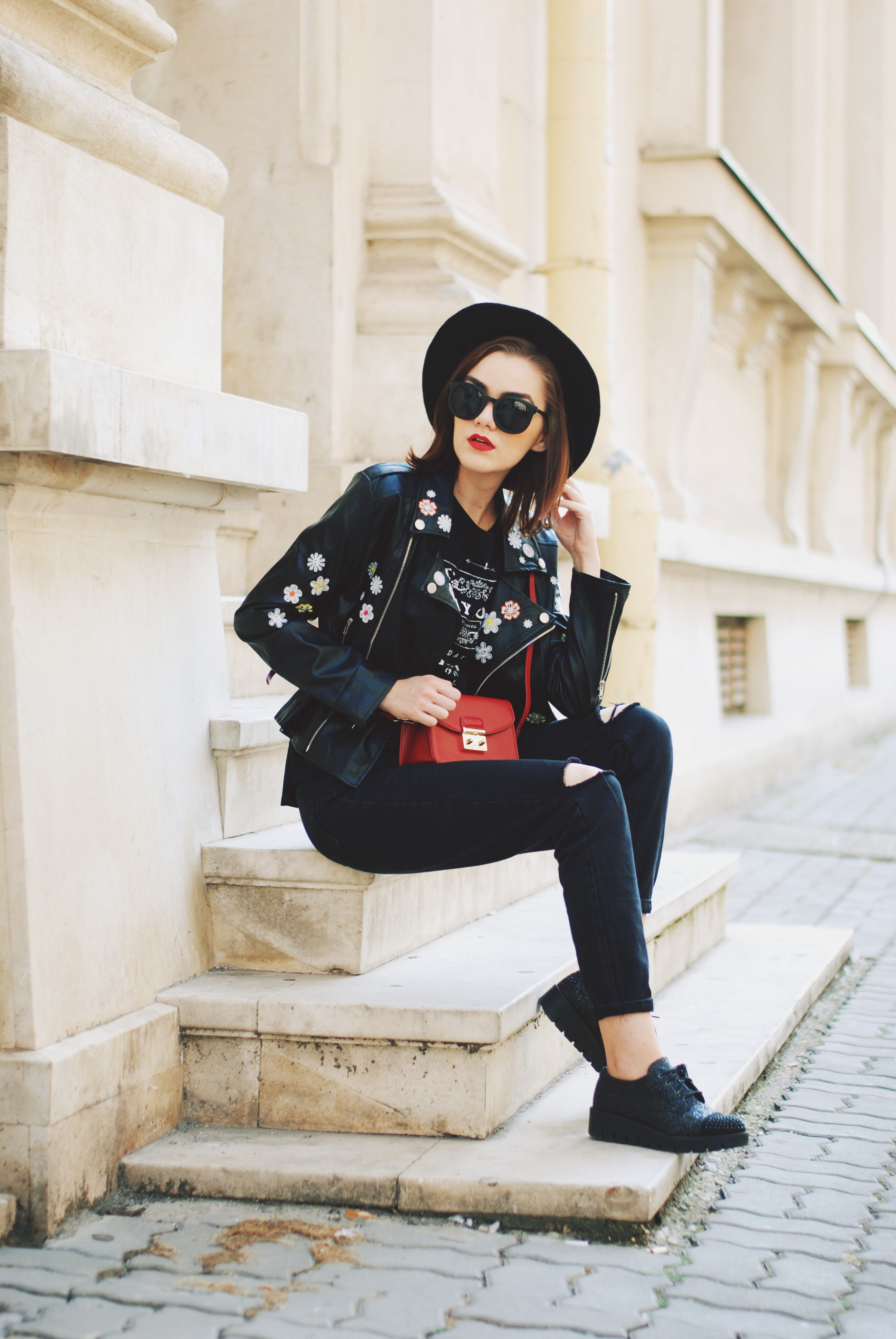 Black mom jeans, printed tshirt, embroidered leather jacket, fedora hat, sunglasses, red crossbody bag, glitter shoes, fall outfit idea, Andreea Birsan