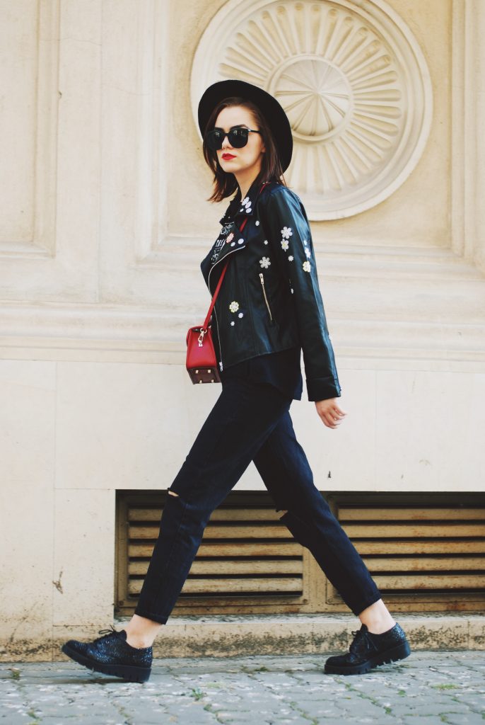 Black mom jeans, printed tshirt, embroidered leather jacket, fedora hat, sunglasses, red crossbody bag, glitter shoes, fall outfit idea, Andreea Birsan