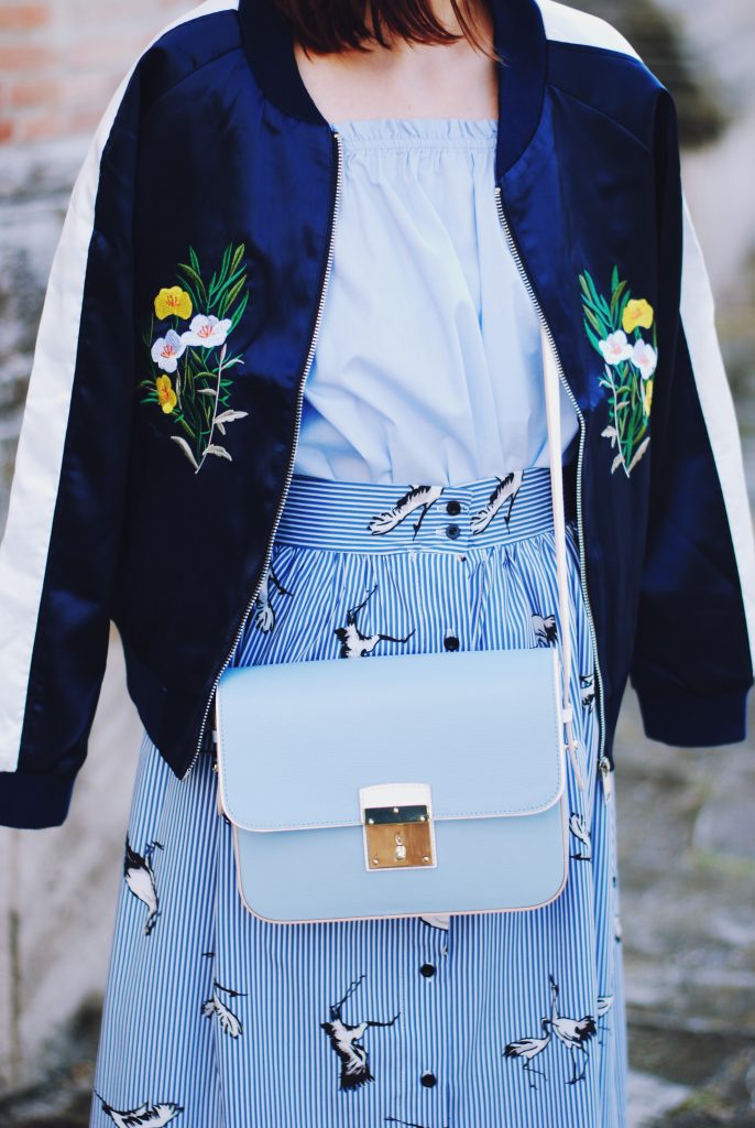 Embroidered bomber jacket, off shoulder top, baby blue crossbody bag, printed midi skirt, gold metallic shoes, sunglasses, fall outfit, Andreea Birsan