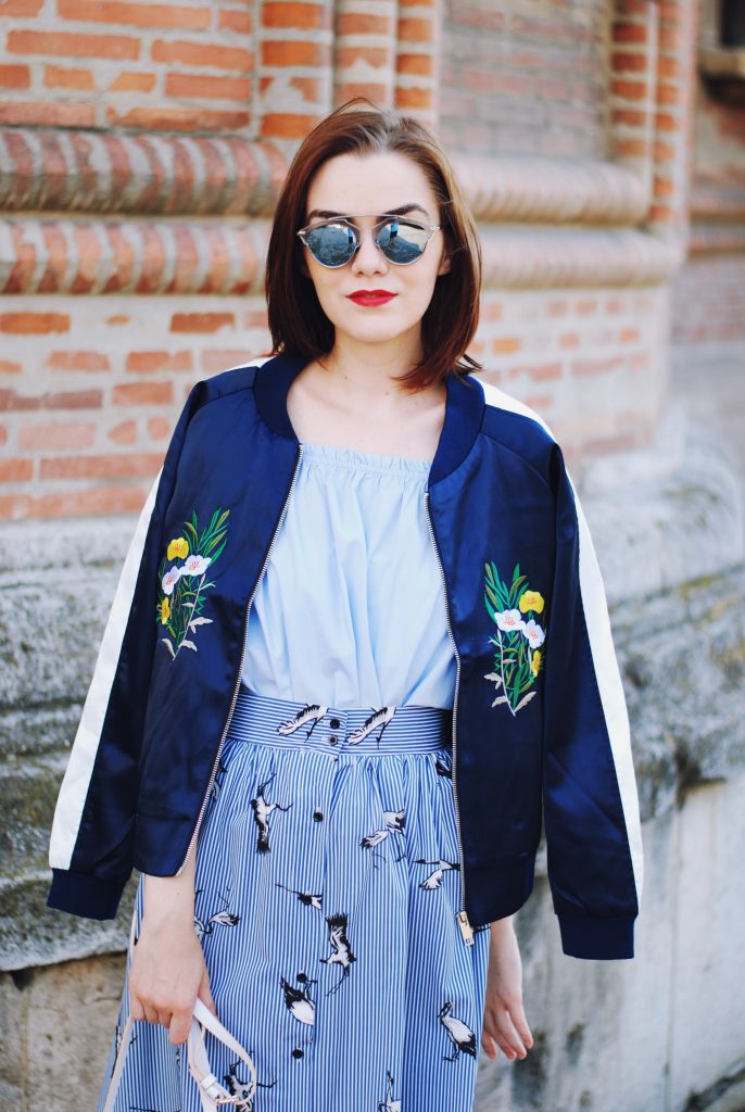 Embroidered bomber jacket, off shoulder top, baby blue crossbody bag, printed midi skirt, gold metallic shoes, sunglasses, fall outfit, Andreea Birsan