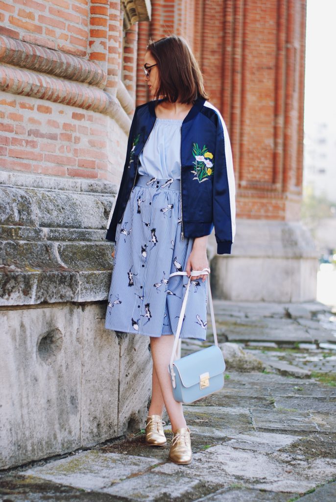 Embroidered bomber jacket, off shoulder top, baby blue crossbody bag, printed midi skirt, gold metallic shoes, sunglasses, fall outfit, Andreea Birsan