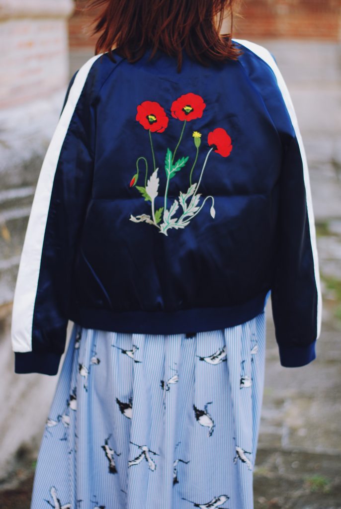 Embroidered bomber jacket, off shoulder top, baby blue crossbody bag, printed midi skirt, gold metallic shoes, sunglasses, fall outfit, Andreea Birsan