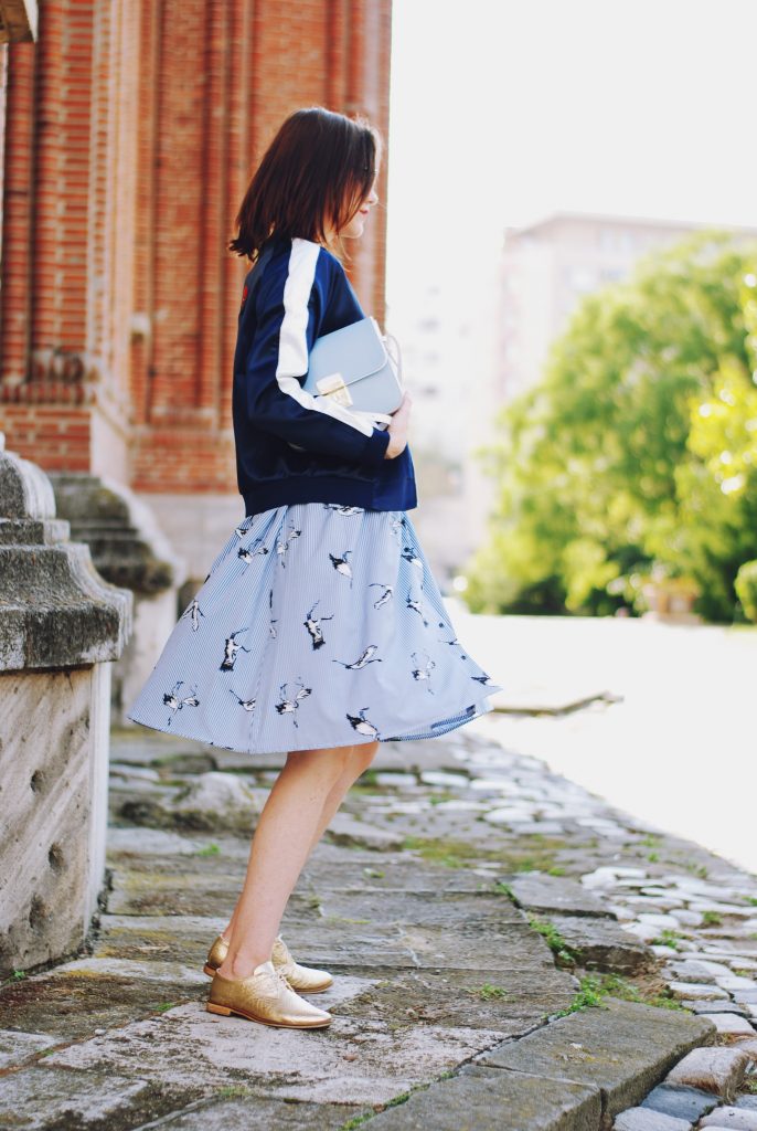 Embroidered bomber jacket, off shoulder top, baby blue crossbody bag, printed midi skirt, gold metallic shoes, sunglasses, fall outfit, Andreea Birsan