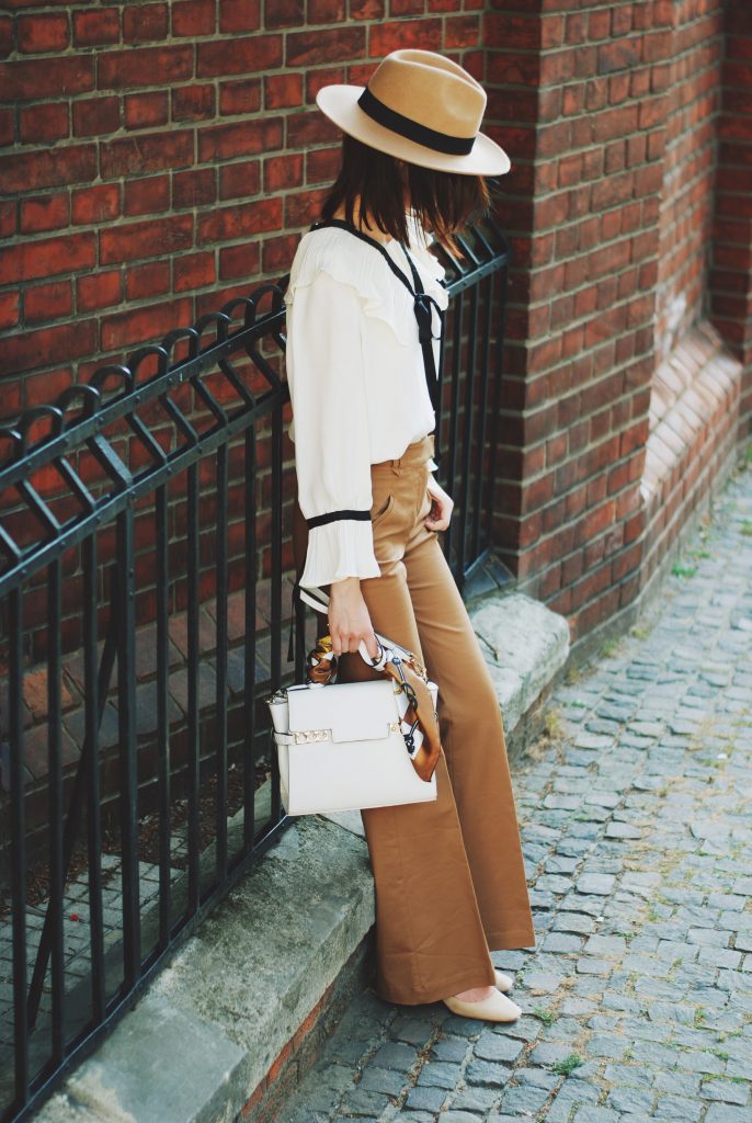 Camel fedora hat, camel flared pants trousers, ruffle top, scarf, white crossbody bag, beige pumps, dior sunglasses, cute autumn outfit idea, Andreea Birsan