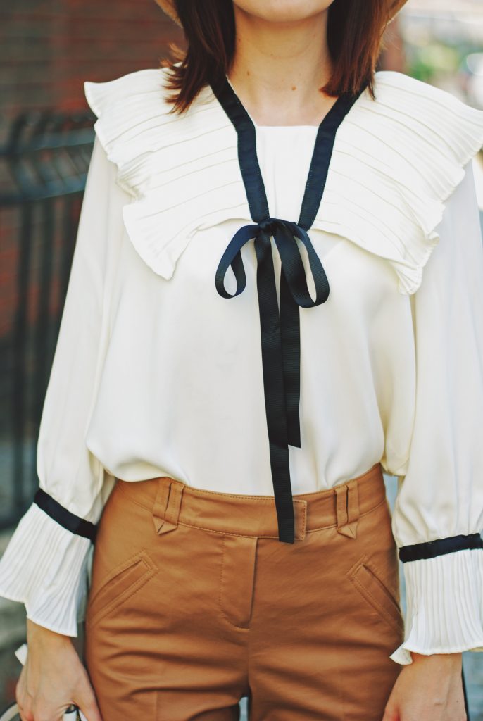 Camel fedora hat, camel flared pants trousers, ruffle top, scarf, white crossbody bag, beige pumps, dior sunglasses, cute autumn outfit idea, Andreea Birsan