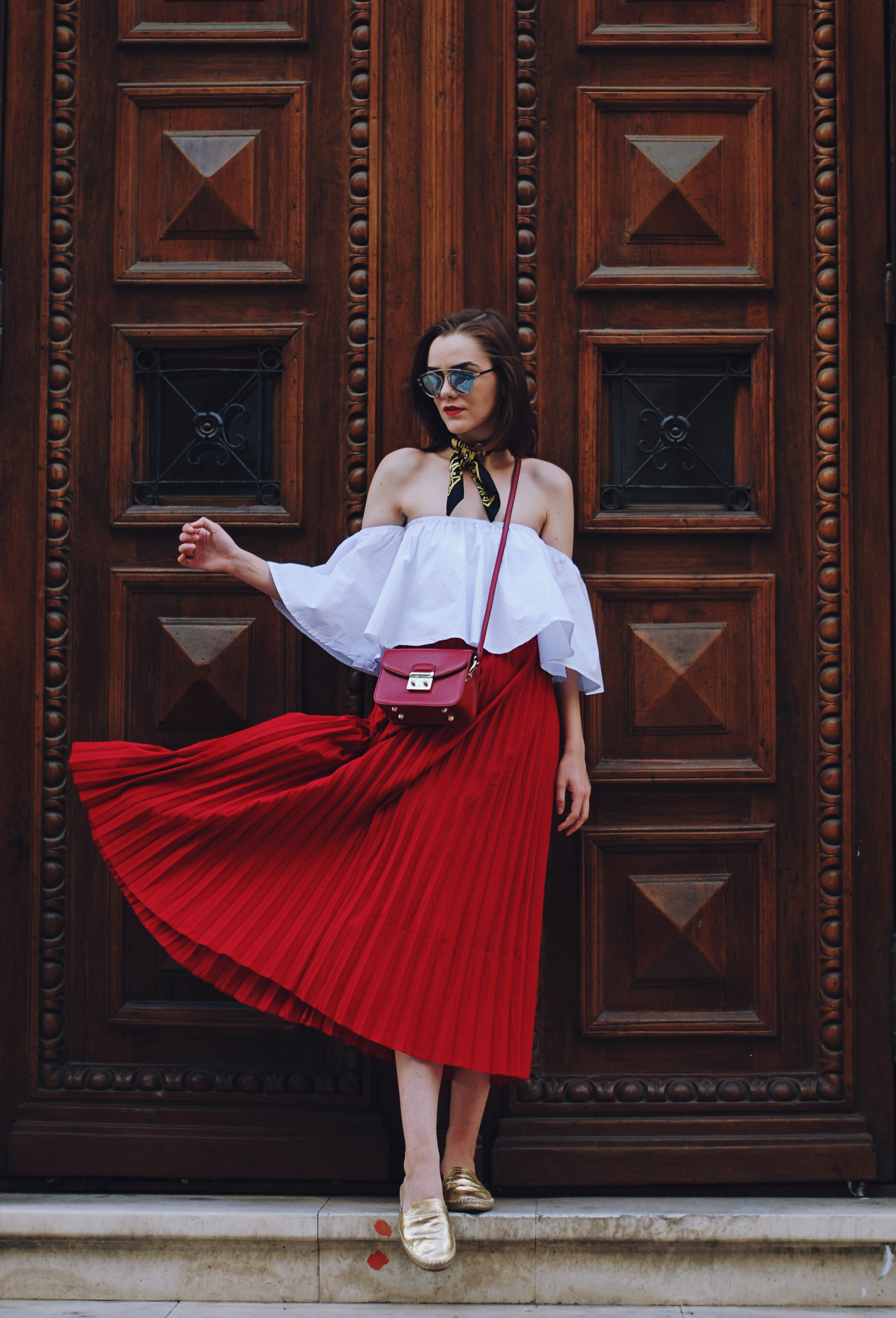 Pleated red midi skirt, white off shoulder top, scarf, red crossbody bag, gold metallic flat mules, dior sunglasses, cute autumn outfit, Andreea Birsan