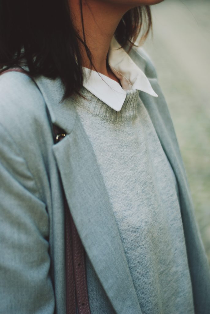 White shirt, grey pants trousers, grey sweater, grey coat, white sneakers, glitter socks, floral crossbody bag, all grey outfit for fall, Andreea Birsan