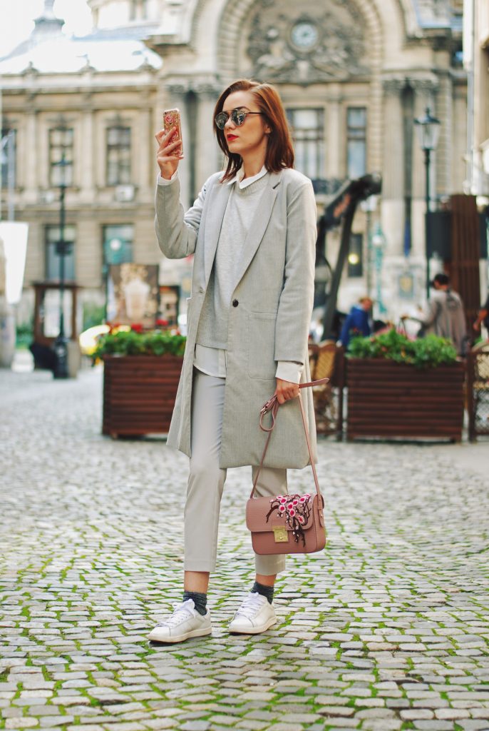 White shirt, grey pants trousers, grey sweater, grey coat, white sneakers, glitter socks, floral crossbody bag, all grey outfit for fall, Andreea Birsan