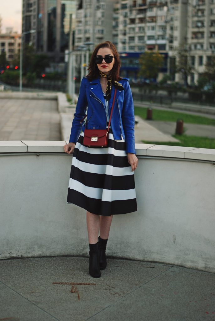 Blue leather jacket, white contrast top, cat eye sunglasses, striped midi skirt, zara leather ankle boots, red crossbody bag, scarf, cute best fall outfit idea, Andreea Birsan