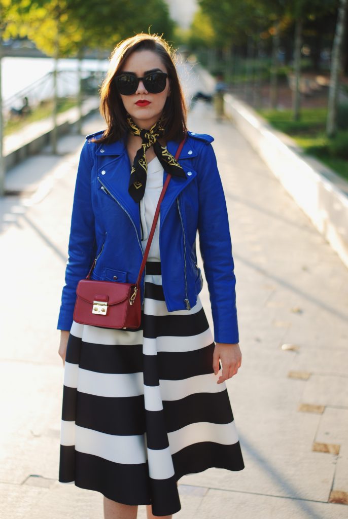 Blue leather jacket, white contrast top, cat eye sunglasses, striped midi skirt, zara leather ankle boots, red crossbody bag, scarf, cute best fall outfit idea, Andreea Birsan