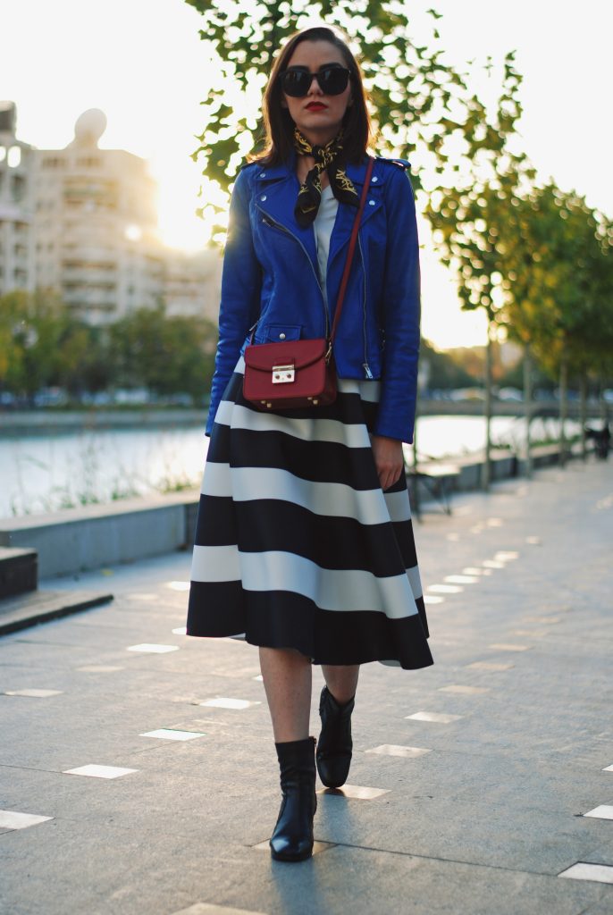 Blue leather jacket, white contrast top, cat eye sunglasses, striped midi skirt, zara leather ankle boots, red crossbody bag, scarf, cute best fall outfit idea, Andreea Birsan