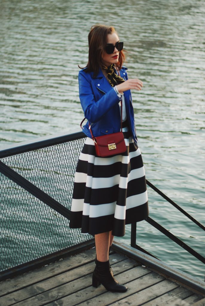 Blue leather jacket, white contrast top, cat eye sunglasses, striped midi skirt, zara leather ankle boots, red crossbody bag, scarf, cute best fall outfit idea, Andreea Birsan