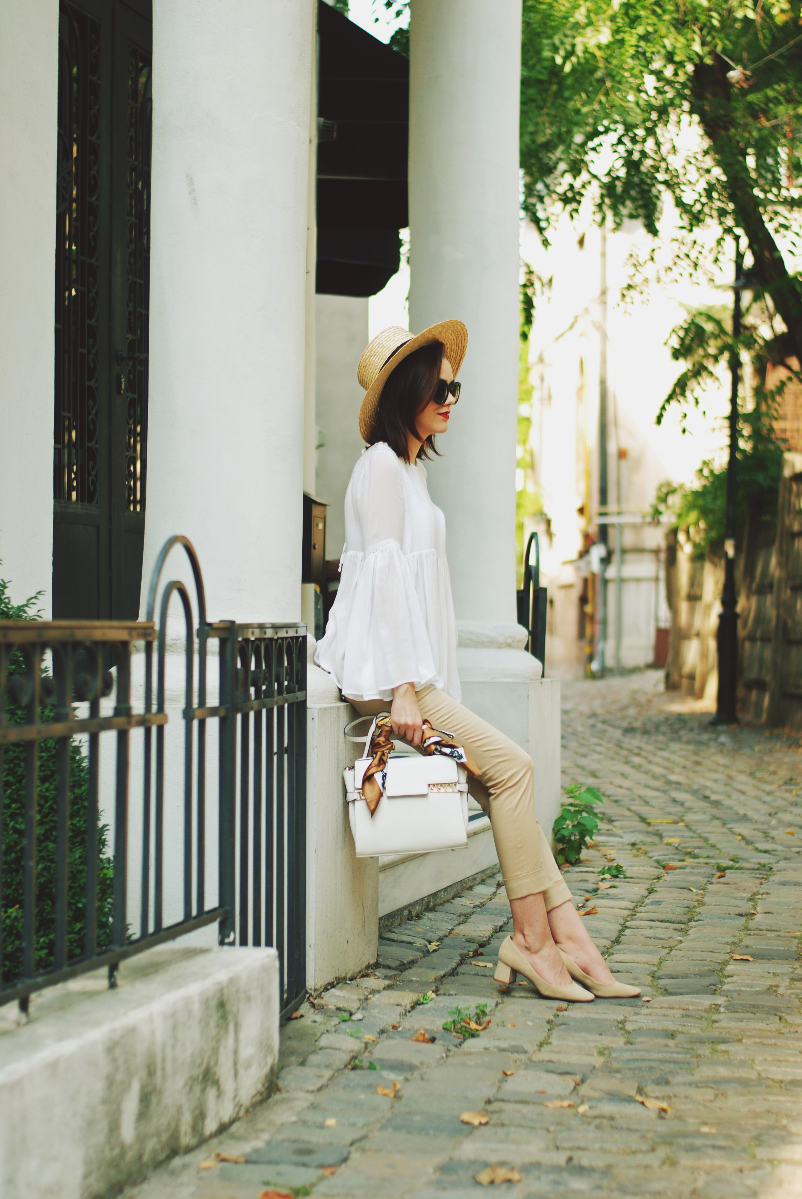 Camel pants trousers, white bell sleeve top, beige suede pumps, straw hat, white crossbody bag, scarf, summer fall outfit idea, Andreea Birsan