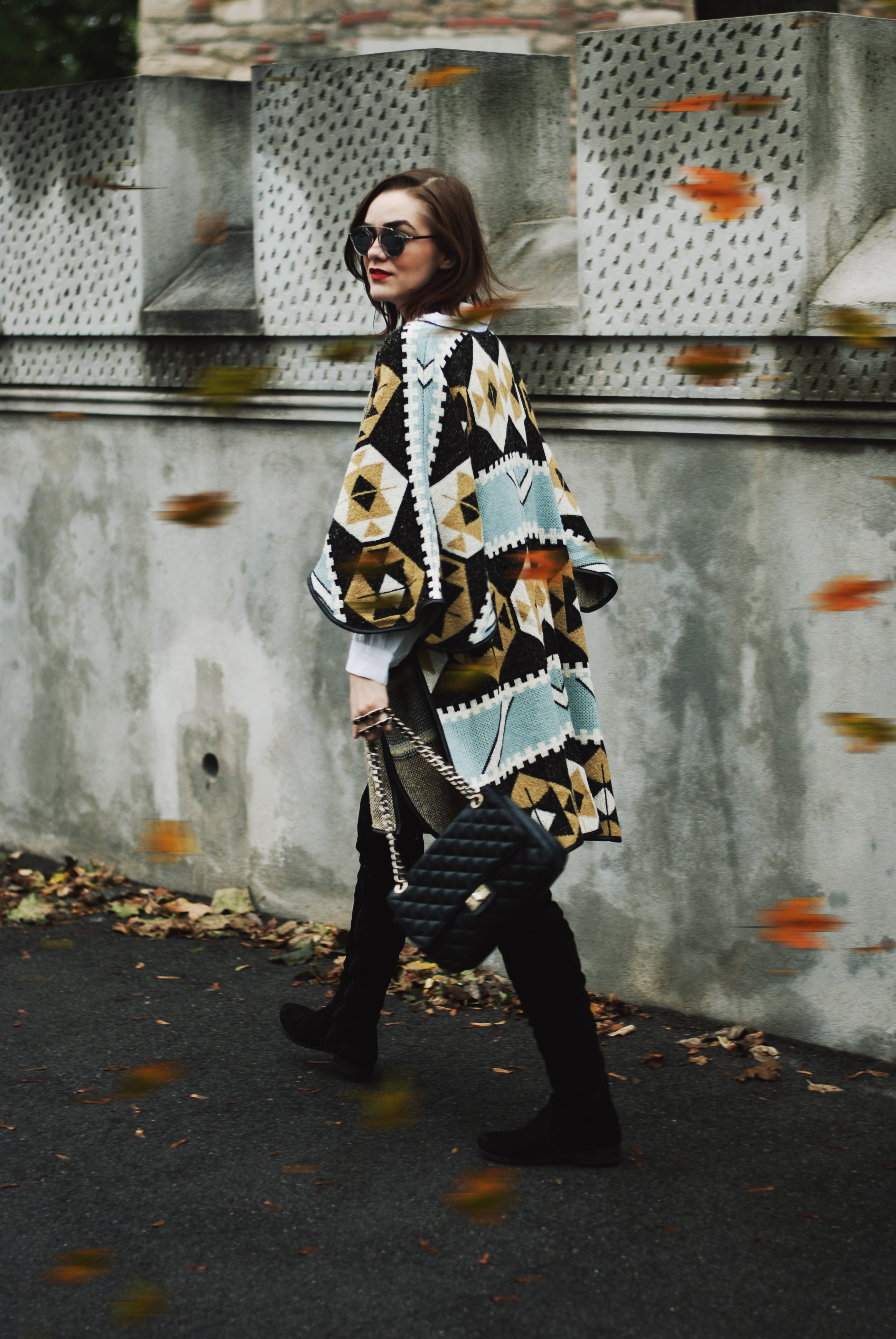 Printed cape, poncho, white button down shirt, distressed mini denim skirt, boots and skirt, graphic tshirt, suede over the knee boots, otk boots, quilted leather crossbody bag, cute and casual fall outfit idea, Andreea Birsan , Couturezilla, christian dior mirrored sunglasses