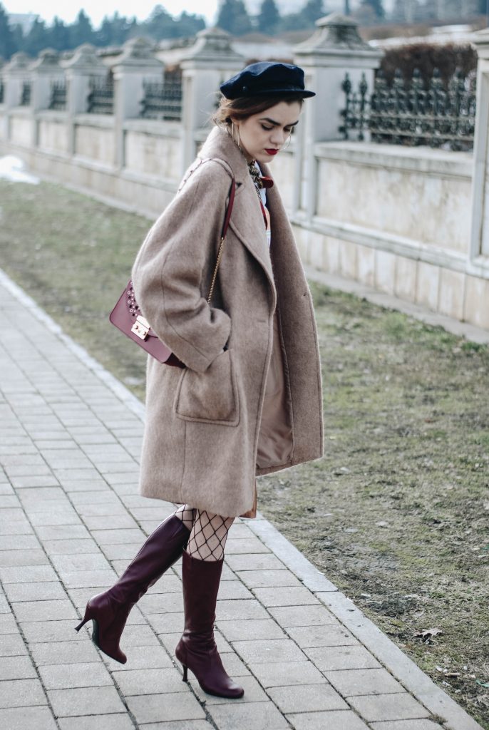 Brown suede midi wrap skirt, graphic tee, fishnet tights, zara navy military hat, tommy hilfiger knee high burgundy boots, furla metropolis red bag, H&M camel beige coat, silver hoop earrings andreea birsan, couturezilla, asos, mango, graphic tshirt, silky scarf, how to look parisian, topshop, fresh casual winter outfit ideas, what to wear a wrap skirt with, how to style knee high boots, pinterest outfits, tumblr outfit, ootd, european fashion blogger, romanian fashion blog