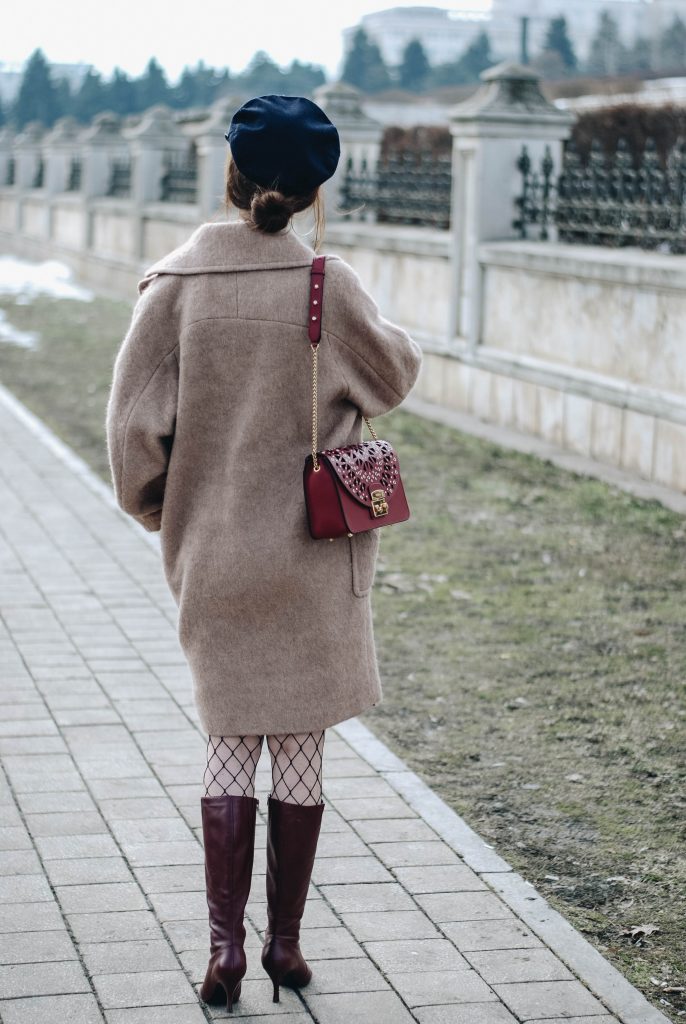 Brown suede midi wrap skirt, graphic tee, fishnet tights, zara navy military hat, tommy hilfiger knee high burgundy boots, furla metropolis red bag, H&M camel beige coat, silver hoop earrings andreea birsan, couturezilla, asos, mango, graphic tshirt, silky scarf, how to look parisian, topshop, fresh casual winter outfit ideas, what to wear a wrap skirt with, how to style knee high boots, pinterest outfits, tumblr outfit, ootd, european fashion blogger, romanian fashion blog