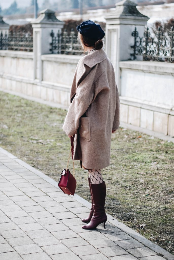 Brown suede midi wrap skirt, graphic tee, fishnet tights, zara navy military hat, tommy hilfiger knee high burgundy boots, furla metropolis red bag, H&M camel beige coat, silver hoop earrings andreea birsan, couturezilla, asos, mango, graphic tshirt, silky scarf, how to look parisian, topshop, fresh casual winter outfit ideas, what to wear a wrap skirt with, how to style knee high boots, pinterest outfits, tumblr outfit, ootd, european fashion blogger, romanian fashion blog