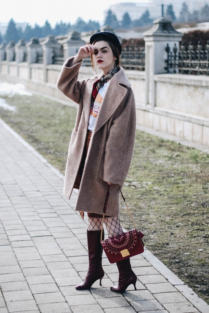 Brown suede midi wrap skirt, graphic tee, fishnet tights, zara navy military hat, tommy hilfiger knee high burgundy boots, furla metropolis red bag, H&M camel beige coat, silver hoop earrings andreea birsan, couturezilla, asos, mango, graphic tshirt, silky scarf, how to look parisian, topshop, fresh casual winter outfit ideas, what to wear a wrap skirt with, how to style knee high boots, pinterest outfits, tumblr outfit, ootd, european fashion blogger, romanian fashion blog