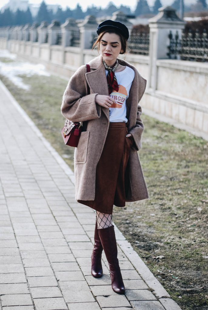 Brown suede midi wrap skirt, graphic tee, fishnet tights, zara navy military hat, tommy hilfiger knee high burgundy boots, furla metropolis red bag, H&M camel beige coat, silver hoop earrings andreea birsan, couturezilla, asos, mango, graphic tshirt, silky scarf, how to look parisian, topshop, fresh casual winter outfit ideas, what to wear a wrap skirt with, how to style knee high boots, pinterest outfits, tumblr outfit, ootd, european fashion blogger, romanian fashion blog