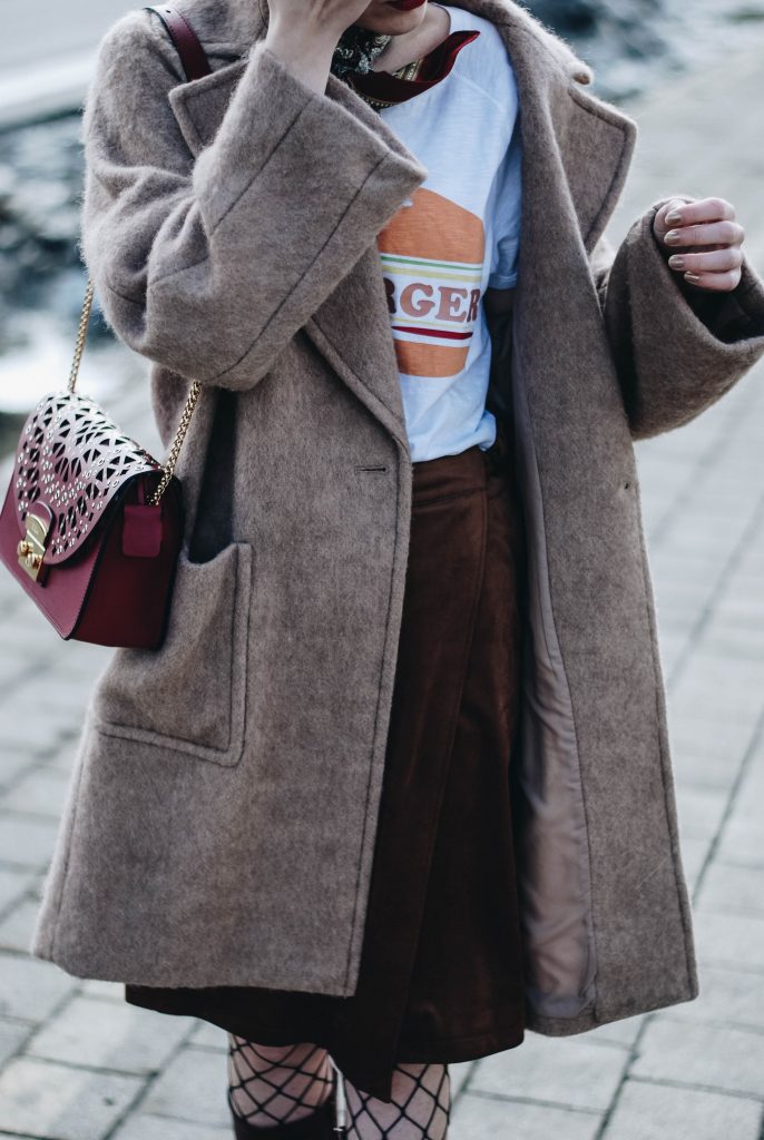 Brown suede midi wrap skirt, graphic tee, fishnet tights, zara navy military hat, tommy hilfiger knee high burgundy boots, furla metropolis red bag, H&M camel beige coat, silver hoop earrings andreea birsan, couturezilla, asos, mango, graphic tshirt, silky scarf, how to look parisian, topshop, fresh casual winter outfit ideas, what to wear a wrap skirt with, how to style knee high boots, pinterest outfits, tumblr outfit, ootd, european fashion blogger, romanian fashion blog