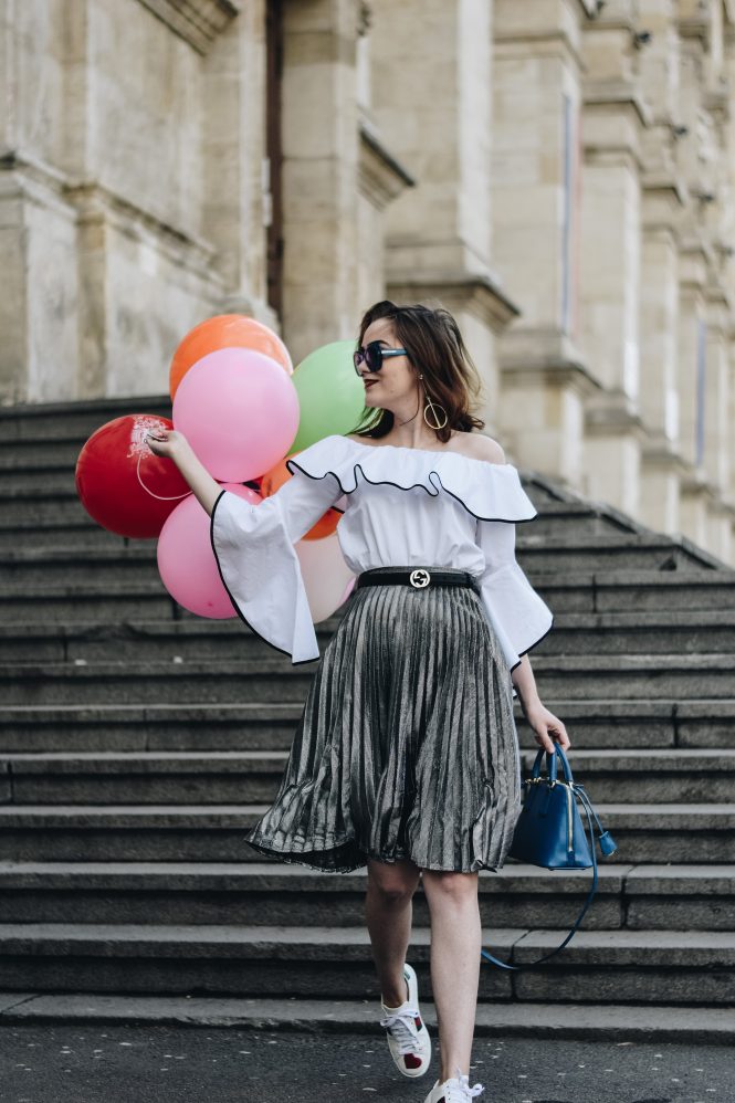 Zara contrast frill off shoulder top, ruffle shirt, mango pleated silver metallic midi skirt, gucci ace sneakers, gucci belt, prada blue mini bag, prada saffiano lux cobalt blue borsa del mano bag, topshop shirt, asos skirt, happy, dolce&gabanna blue square sunglasses, coutuerzilla, andreea birsan, cute spring outfit ideas 2017, blog anniversary, couturezilla's anniversary, celebrating outfit, european blogger, spring european street style inspo, ootd, outfit of the day, style inspiration, fashionista, bucharest, balloons, heart embroidered white leather sneakers, leather belt, how to wear a pleated midi skirt, spring fashion trends for 2017, chic pinterest outfit for women, tumblr girls, how to look cute in a skirt and sneakers, gold hoop earrings, romanian fashion blogger, how to dress on a date, minimal outfit, smart casual outfit ideas