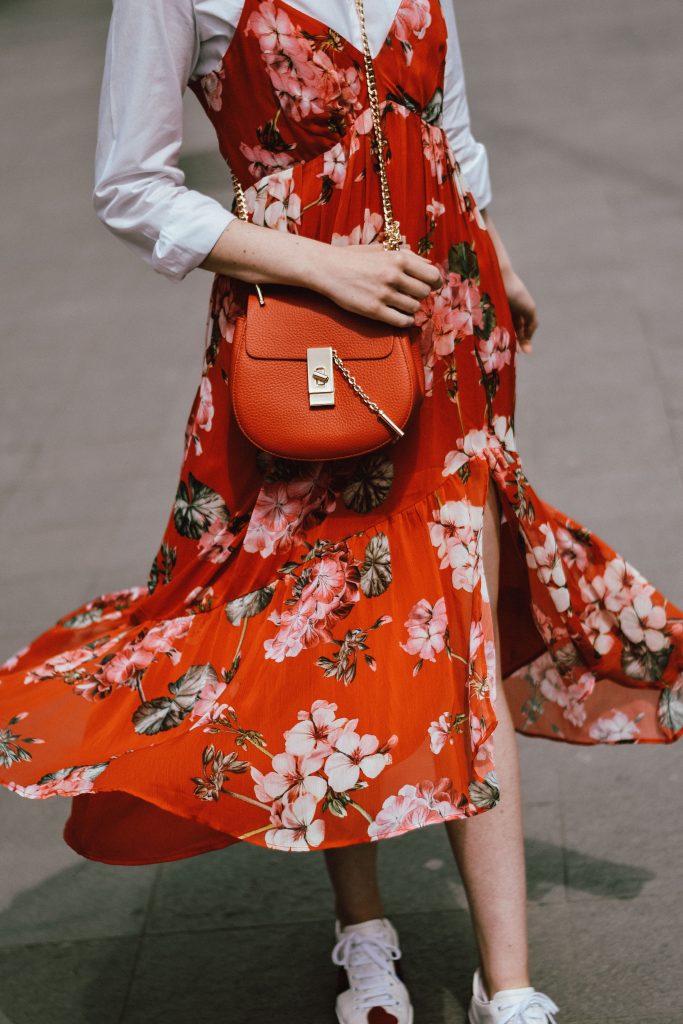 Mango midi red floral dress, asos white button down shirt, gucci ace heart white sneakers, topshop dress, white leather sneakers, kicks, red chloe drew bag, chloe drew lookalike bag, zara round 50mm mirrored sunglasses, ray ban sunnnies, gold earrings, layering with a slip dress, andreea birsan, couturezilla, cute spring outfit inspiration 2017, spring style, what to shop, chic oh a budget, spring minimal and girly outfit, european fashion blogger, romanian fashion blog, casual spring ootd, outfit of the day, minimal pinterest outfit for women, spring european street style 2017, tumblr girls inspo, red lipstick, messy bun, fashionista, leather crossbody bag, ruffle hem dress