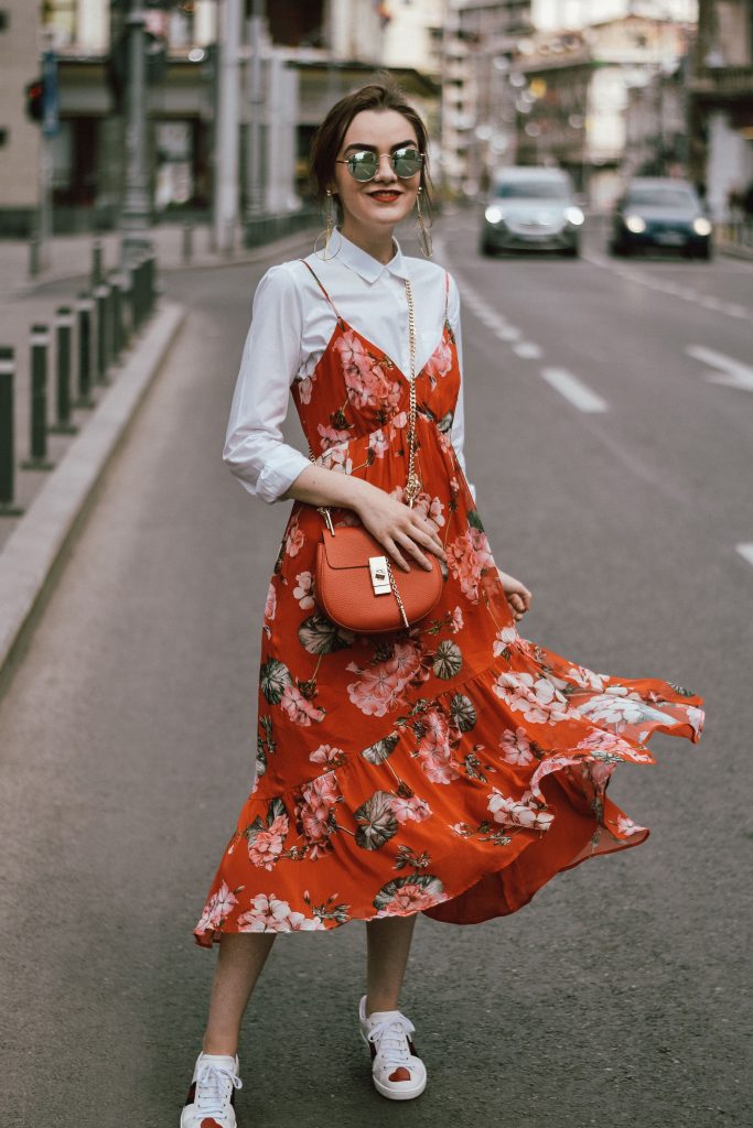 Cute spring outfit ideas for 2017, andreea birsan, couturezilla, european street style, pinterest chic outfits for women, minimal ootd, outfit of the day, how to pull off double denim, canadian tuxedo, mango red midi floral embroidered dress, levi's jeans, boyfriend denim, pearled jeans, topshop orange blazer, straw hat, silk scarf, prada cobalt blue bag, saffiano lux bag, gucci ace sneakers, heart embroidered sneakers, white sneakers, beige suede mules, red sunglasses, dolce and gabanna blue square sugnglasses, april outfit ideas recap, zara beige trench coat, spring trends moodboard, furla linda s tote bag, fur charms, how to pull off a red suit, lace up corset, raffia bag, woven bag, straw, striped shirt, how to look parisian chic, silk scarf, romanian fashion blog, european fashion blogger