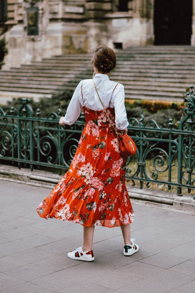 Mango midi red floral dress, asos white button down shirt, gucci ace heart white sneakers, topshop dress, white leather sneakers, kicks, red chloe drew bag, chloe drew lookalike bag, zara round 50mm mirrored sunglasses, ray ban sunnnies, gold earrings, layering with a slip dress, andreea birsan, couturezilla, cute spring outfit inspiration 2017, spring style, what to shop, chic oh a budget, spring minimal and girly outfit, european fashion blogger, romanian fashion blog, casual spring ootd, outfit of the day, minimal pinterest outfit for women, spring european street style 2017, tumblr girls inspo, red lipstick, messy bun, fashionista, leather crossbody bag, ruffle hem dress